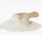 Eggshell Calcium Powder dog supplement powder close-up with wooden scoop