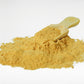 Holistic Skin & Coat Care dog supplement powder close-up with wooden scoop