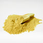 Holistic Liver Care dog supplement powder close-up with wooden scoop